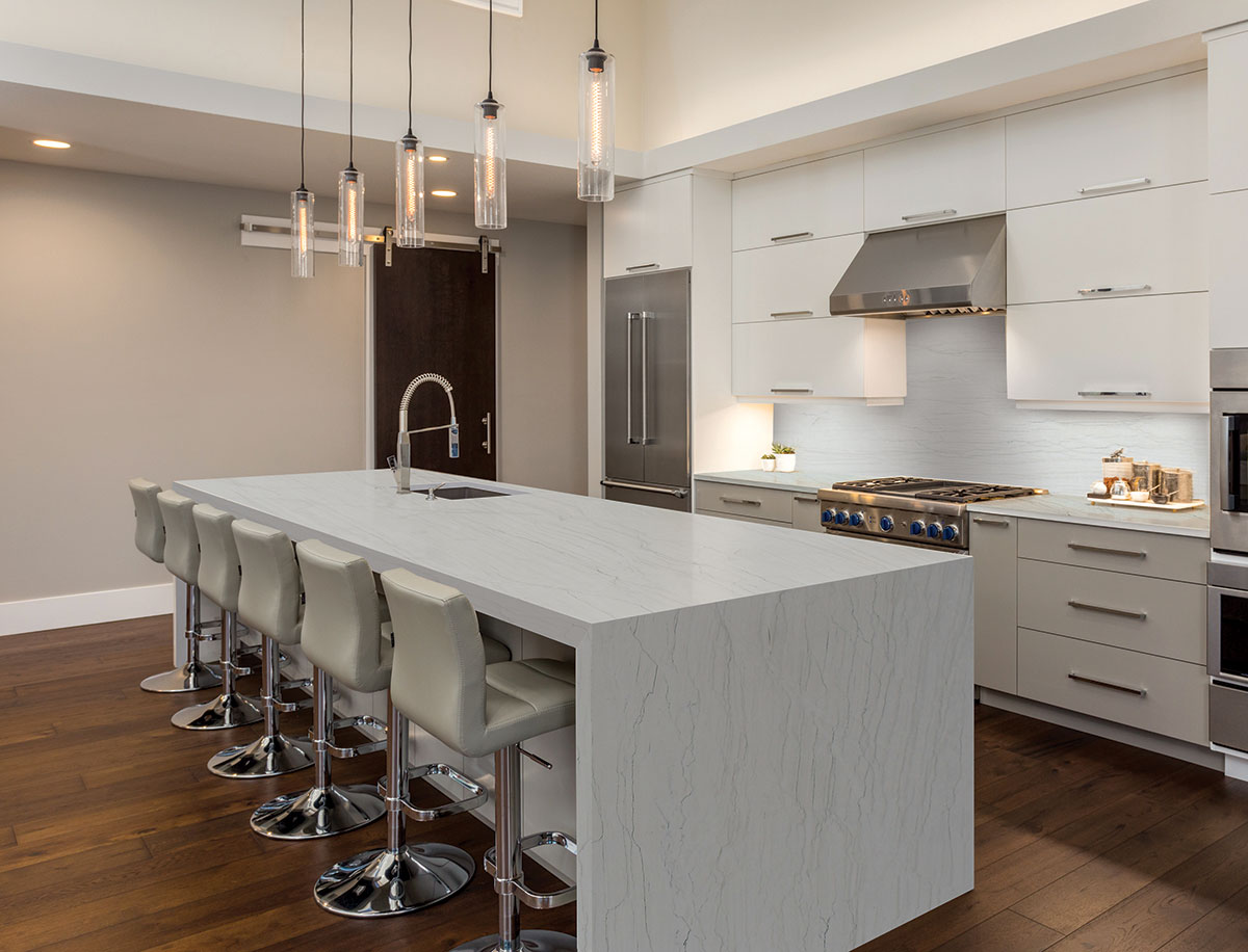 Schmidt Countertops craftsman inspecting a polished granite slab