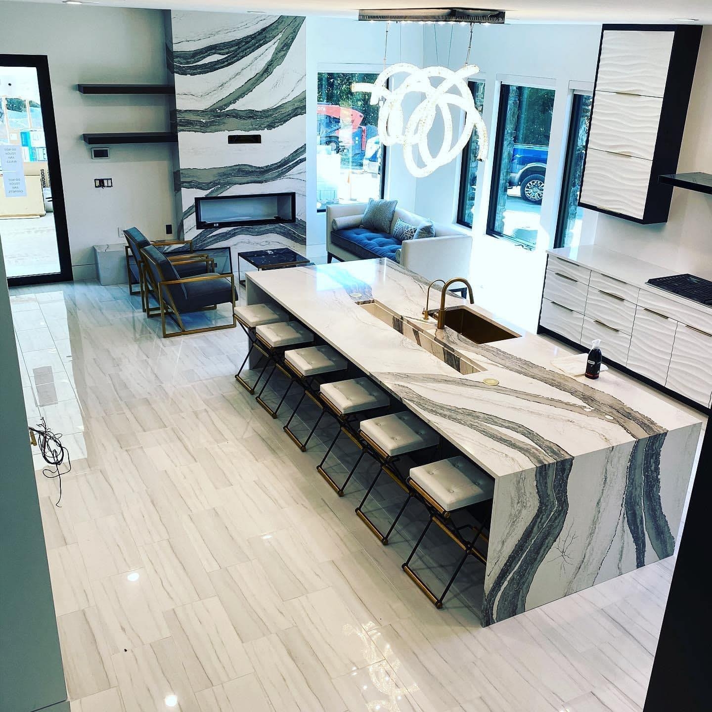 Stone fireplace surround in living room with mantel